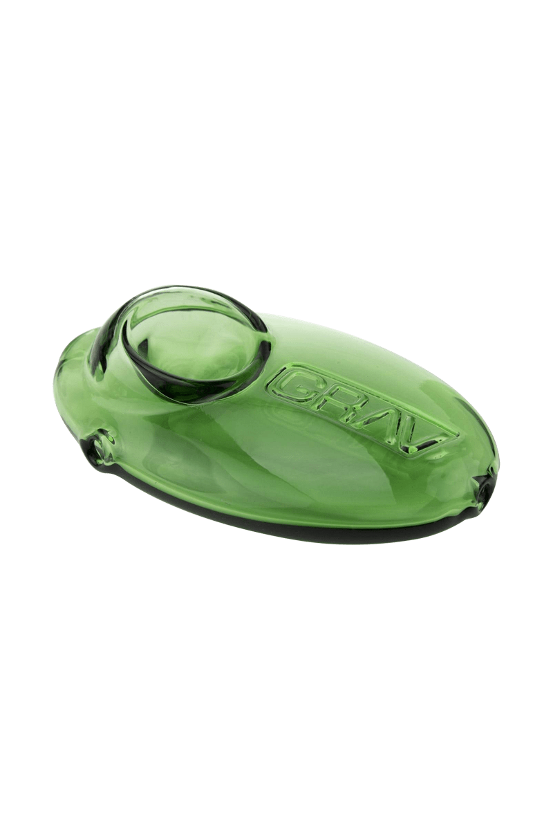 A side view of the Grav Labs Pebble Spoon, showcasing its smooth, curved green glass design.