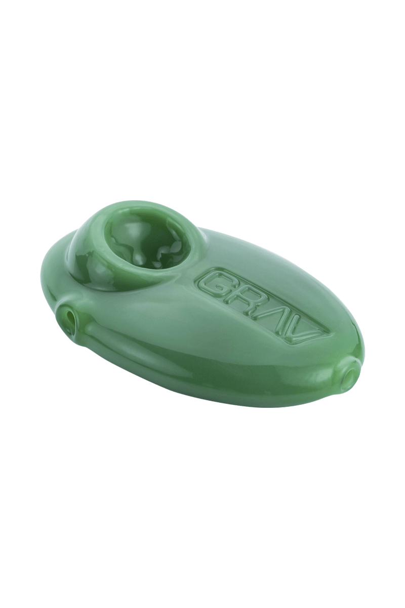 A close-up shows the Grav Labs Pebble Spoon in a smooth, rounded design, viewed from a slight angle.