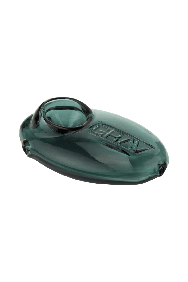 A close-up, angled view of the Grav Labs Pebble Spoon, showing its smooth, rounded glass form.