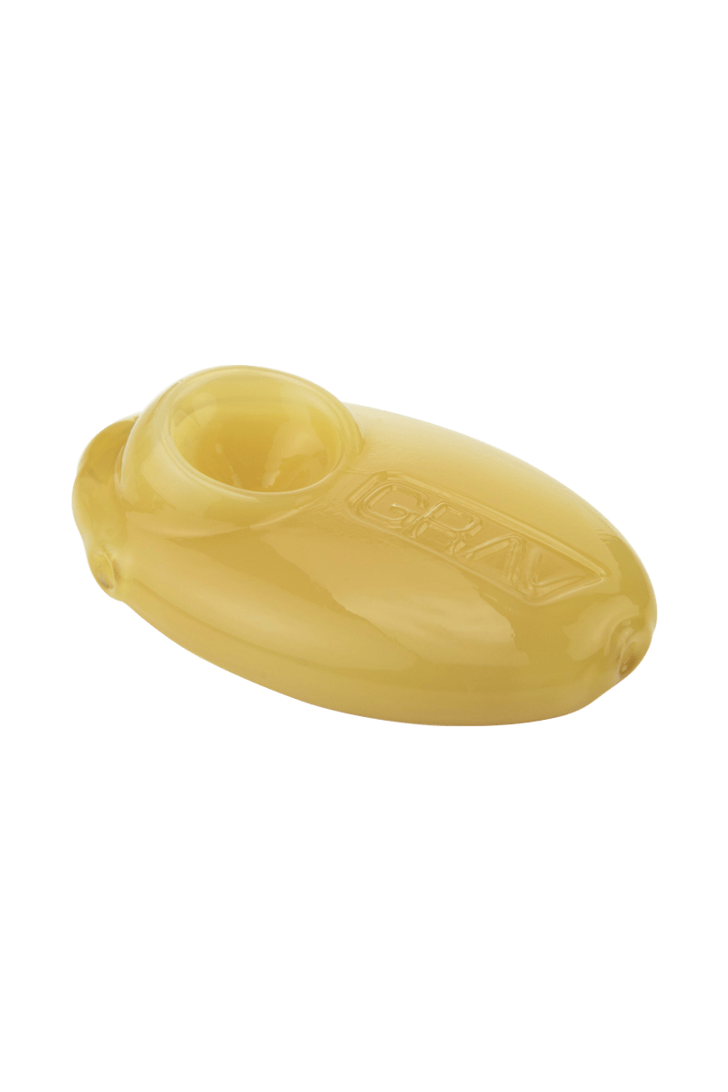 A slightly angled studio shot of the Grav Labs Pebble Spoon, showcasing its smooth, rounded form and glossy finish.
