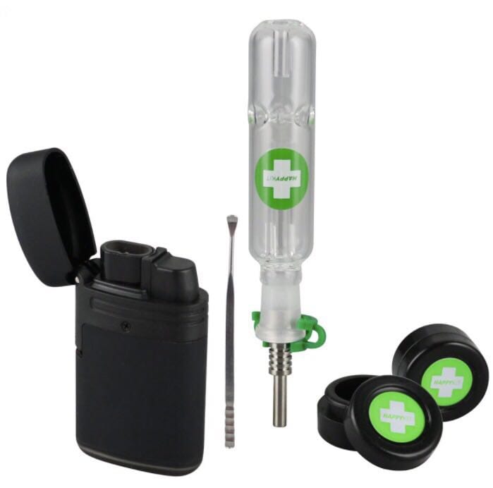 The Happy Dab Kit is displayed with a black case, a silver tool, and two black caps, all arranged on a dark surface.
