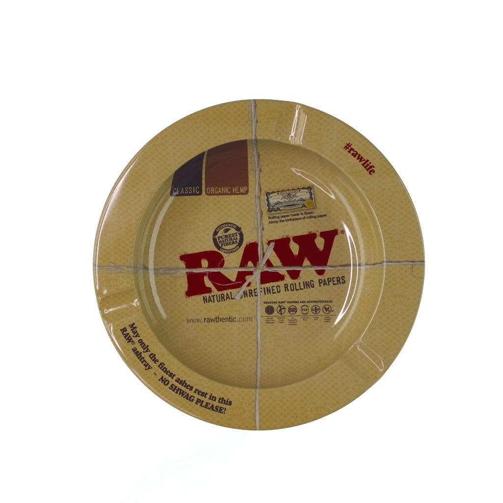 Overhead view of the RAW Metal Ashtray, featuring branding and text on a circular metal surface.