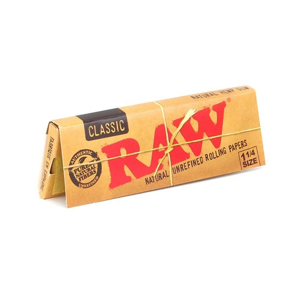 A close-up of the RAW Classic 1 1/4 rolling papers package, displaying the brand's logo against a light background.