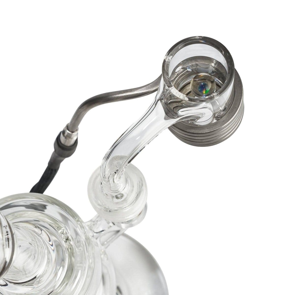 Top-down view of the 25mm Auto Spinner Quartz E-Banger mounted on a clear glass rig, showing the metal 25mm coil, quartz bucket and glass joint arm.