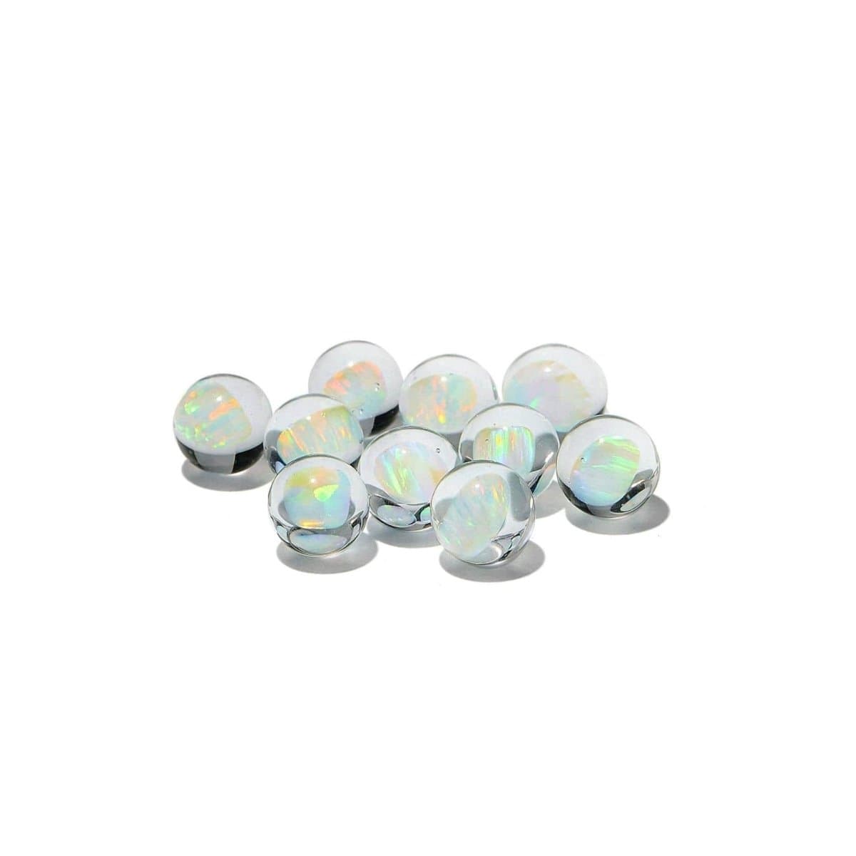 A top-down view of the White Opal, showcasing the product’s rounded shape and reflective surface against a plain background.