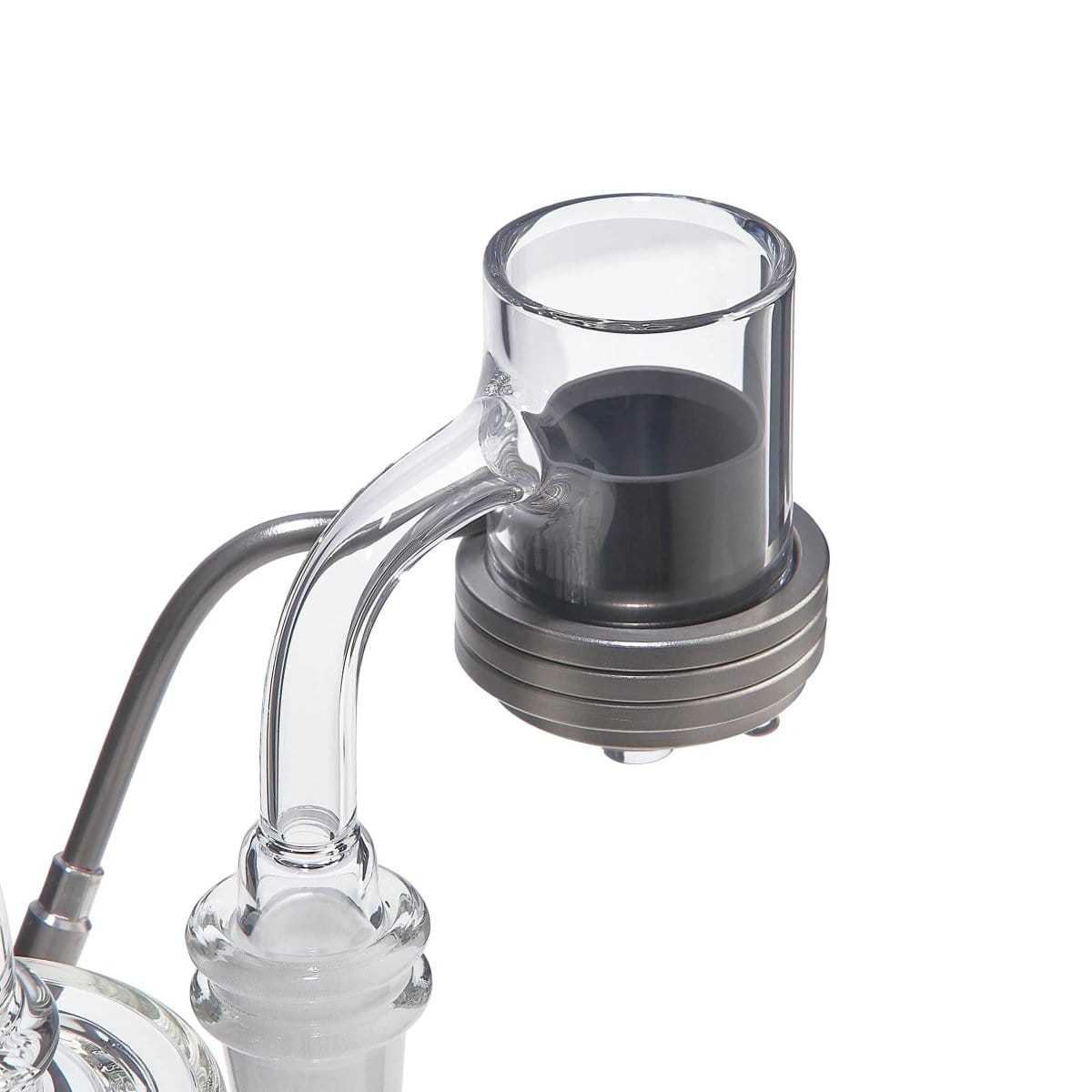 A close-up, angled view of the SIC E-Banger Insert, showcasing its metallic finish and quartz bucket within a glass joint.