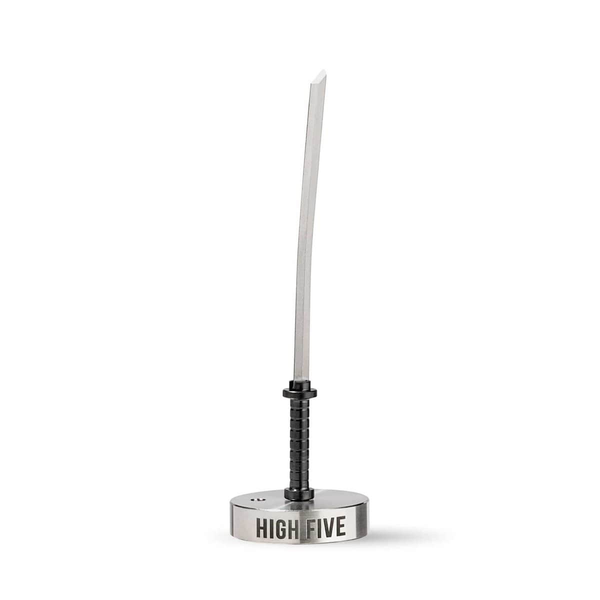 A close-up, angled view of the Silver Katana Carb Cap, displaying its metallic finish and streamlined design.