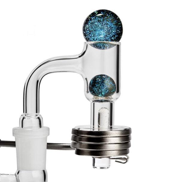 A close-up, angled view of the Terp E-Slurper 14mm Male, showcasing its clear glass construction and unique design.