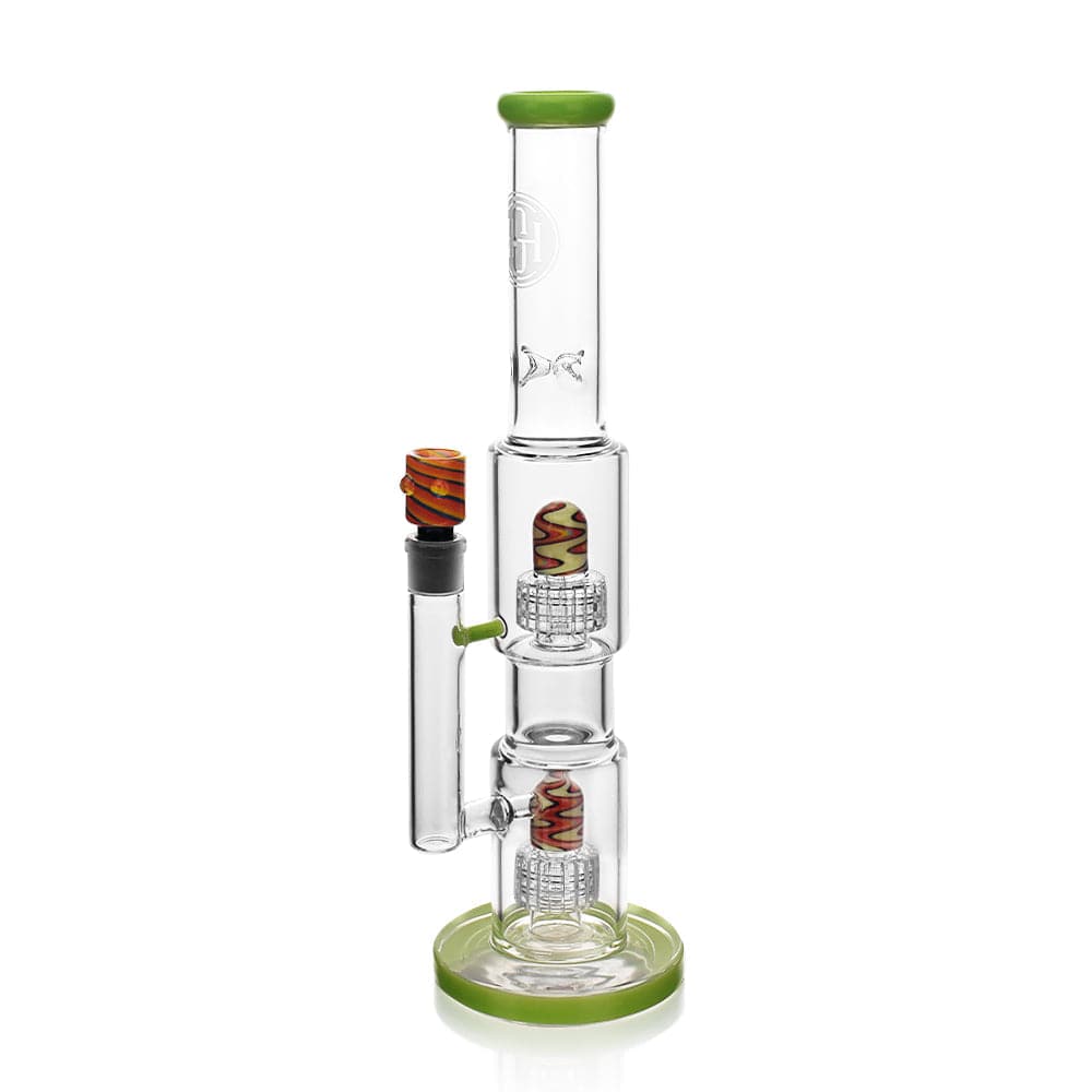 A studio shot of the High Society  Gemini Premium Wig Wag Waterpipe (Green) with a green base and detailed glasswork.