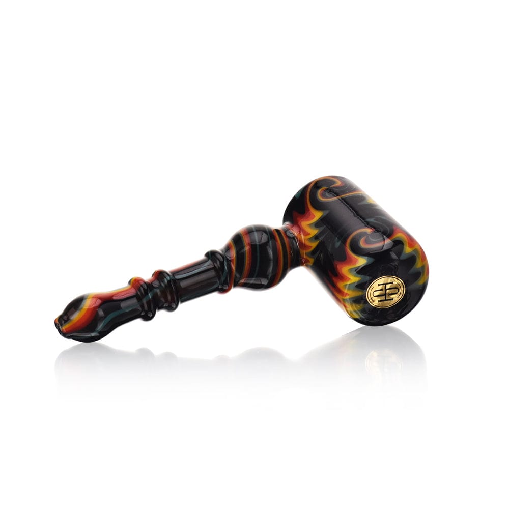 A three-quarter view of the High Society  Eris Premium Wig Wag Bubbler (Black Rainbow V1) with a black and rainbow glass pattern, reflecting on a glossy surface.