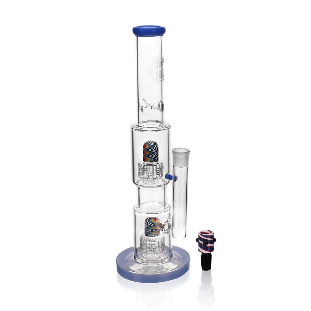 A three-quarter view of the High Society  Gemini Premium Wig Wag Waterpipe (Blue) with a clean, cylindrical form and slight curve.
