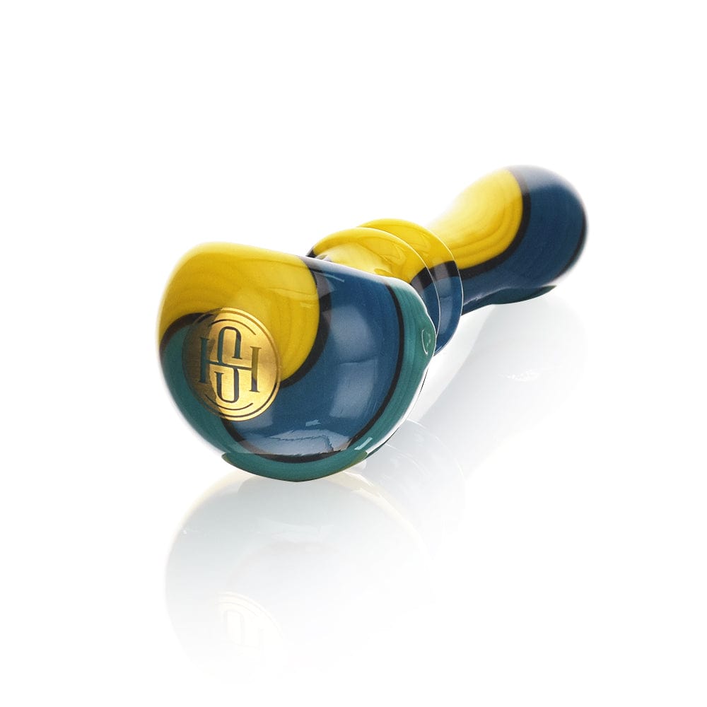 A three-quarter view of the High Society  Helia Premium Wig Wag Spoon (Shaman) with a vibrant blue and yellow swirl design on a clean white surface.