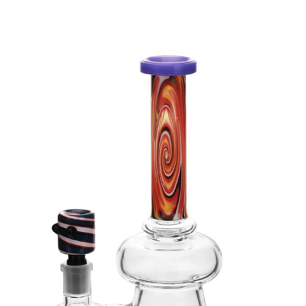 A close-up, angled view of the High Society - Pegasi Premium Wig Wag Hybrid Pipe (Purple) with a colorful, patterned glass stem.