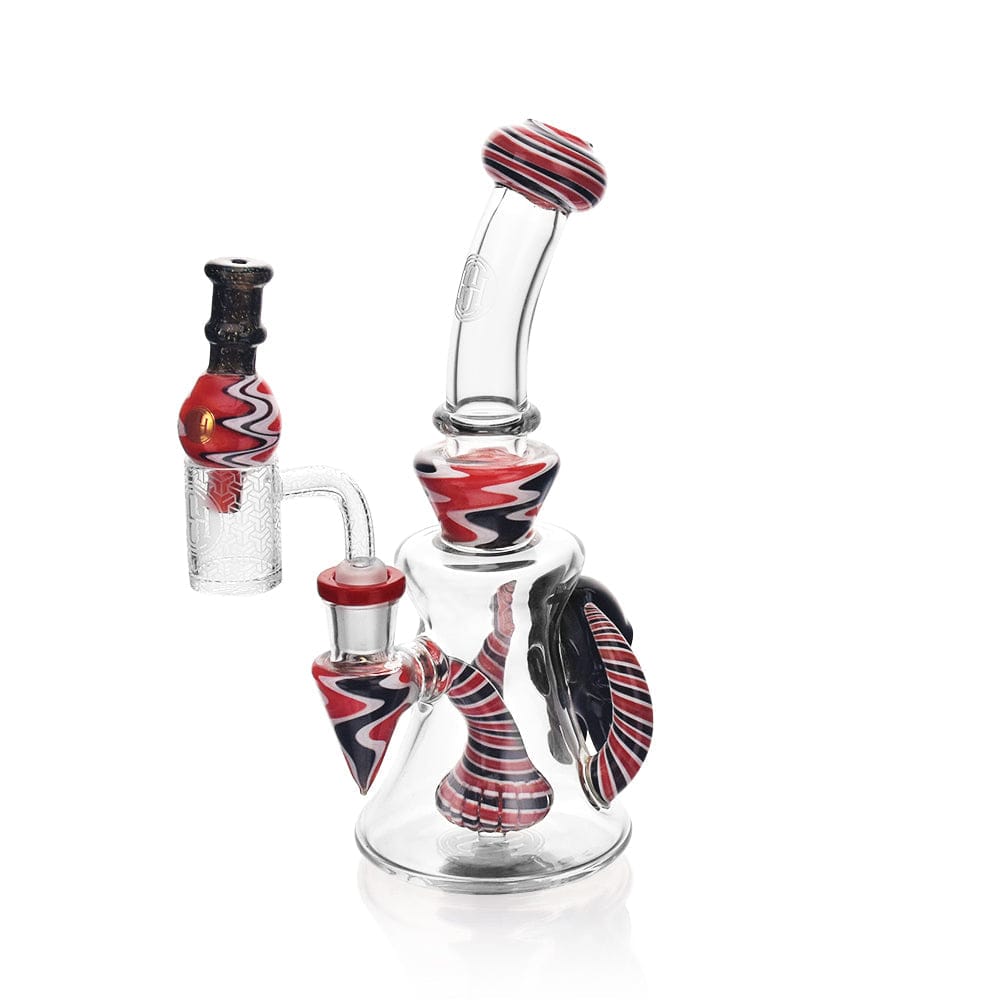 A three-quarter view of the High Society - Tulu Premium Wig Wag Concentrate Rig in red and black, showcasing its curved design and glass joint.