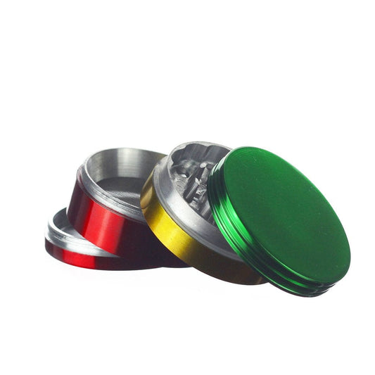 A close-up, angled view of the open Rasta Grinder, revealing its multi-tiered metallic interior.