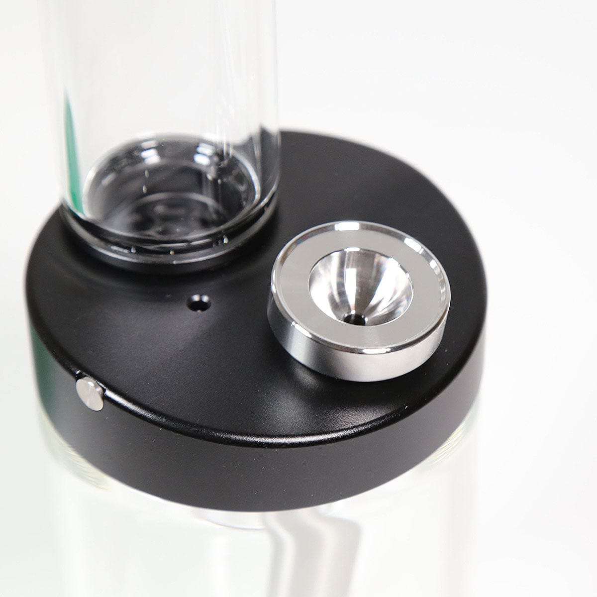 Close-up of the Stainless Steel Bowl Piece, showing its silver metallic finish and circular form against a dark backdrop.