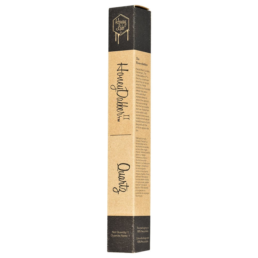 A close-up, angled view of the Honey Dabber II Cherry Wood Dab Straw against a dark background, highlighting its sleek design.