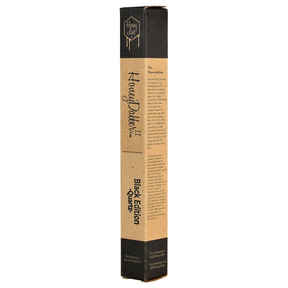 A close-up, angled shot of the Honey Labs HoneyDabber II Black Walnut Vapor Straw in its packaging, highlighting the design details.