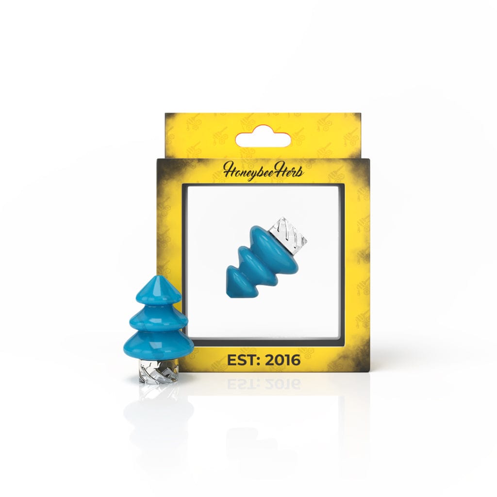 A close-up shot of the TREE TOP SPINNER CARB CAP, showcasing its colorful, tree-like shape against a dark background.