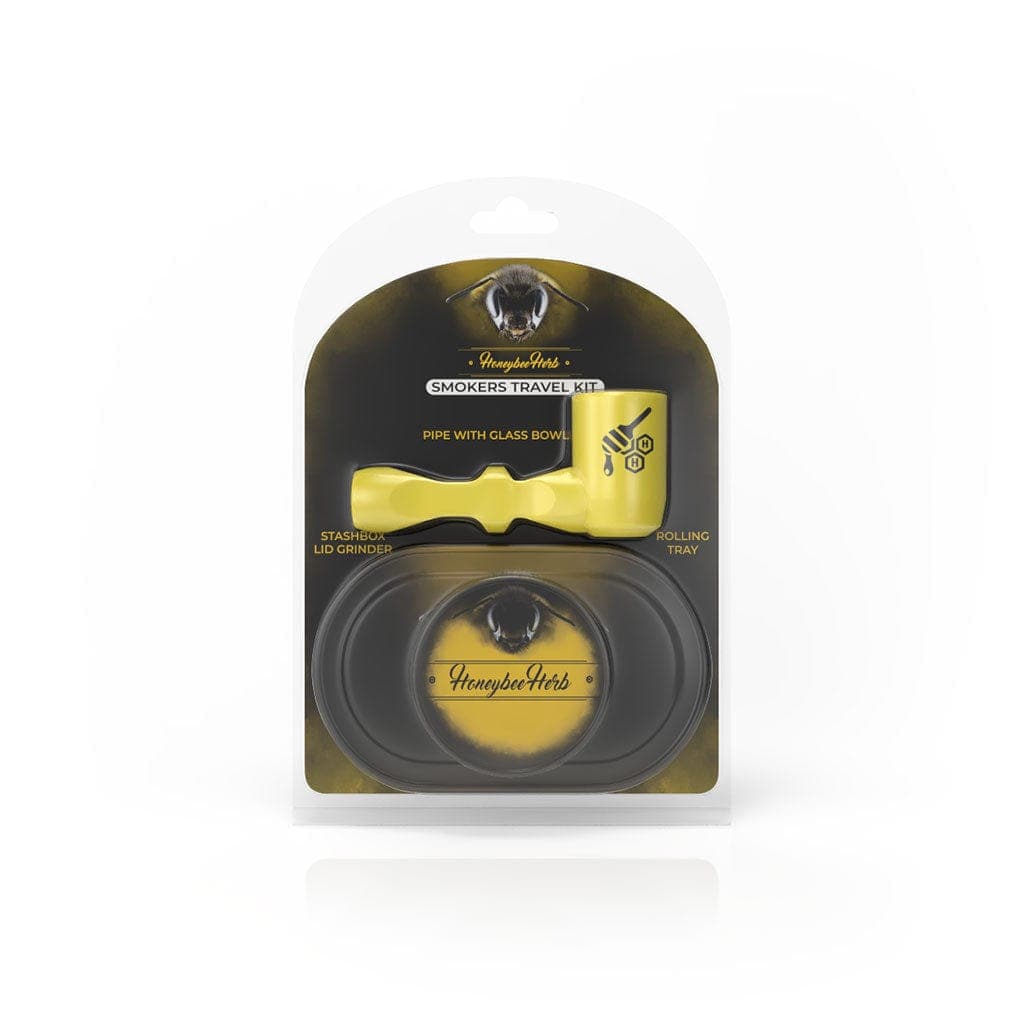 A close-up of the Honeybee Herb Pipe Travel Pack, showcasing its compact size and dark packaging with a branded logo.