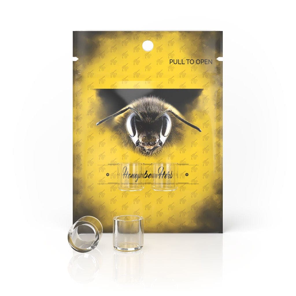 A close-up of the Honeybee Herb Honey Insert Cups packaging, showing a gold-colored design resembling a bee on a clear plastic pouch.