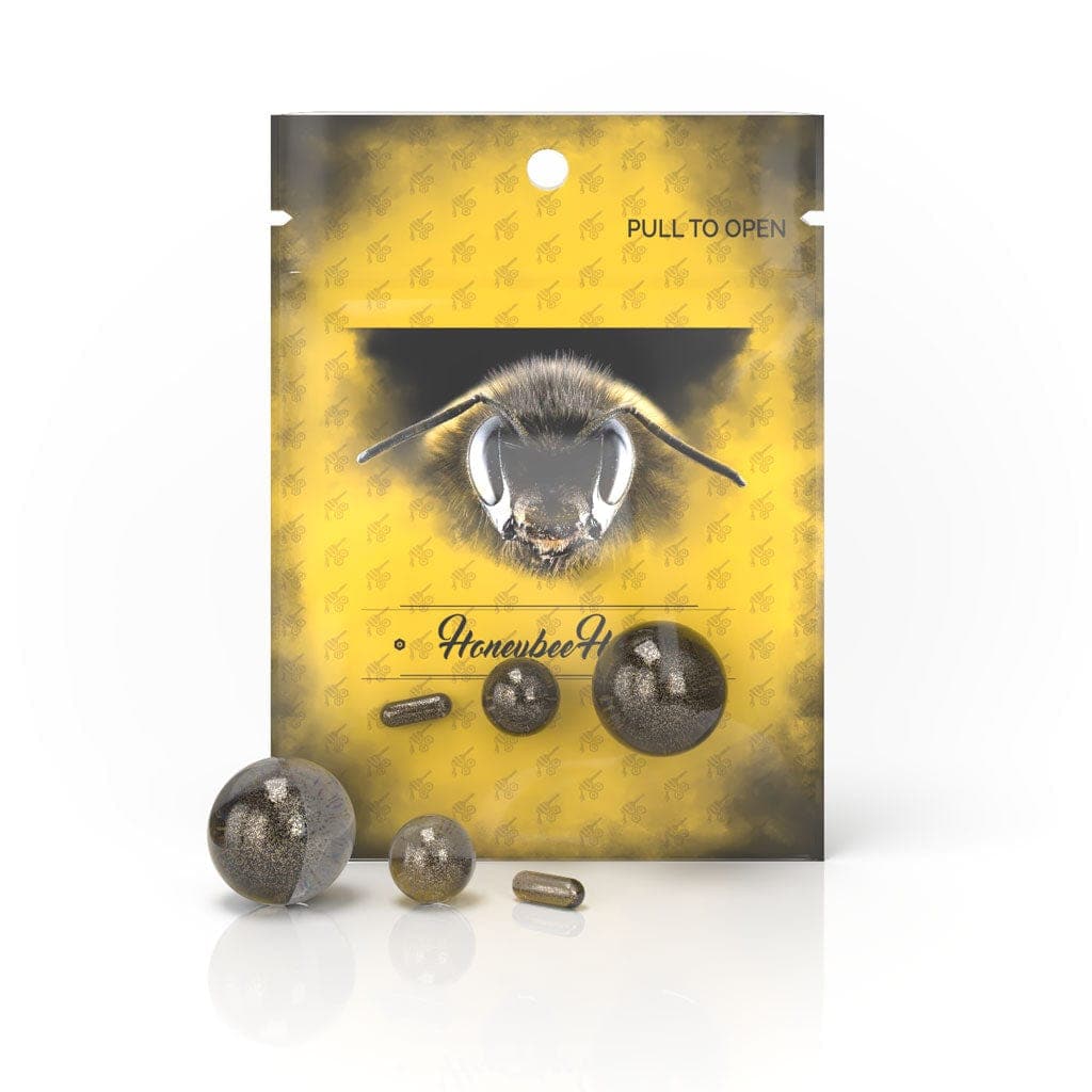 A close-up of the Honeybee Herb Dab Marble Set, showing a collection of colorful, spherical marbles on a patterned background.