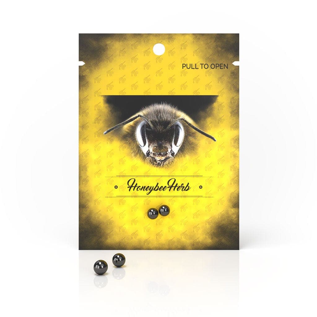 Front view of the Honeybee Herb Honey Pearls packaging, showing a glossy black pouch with text and a pearl-like graphic.