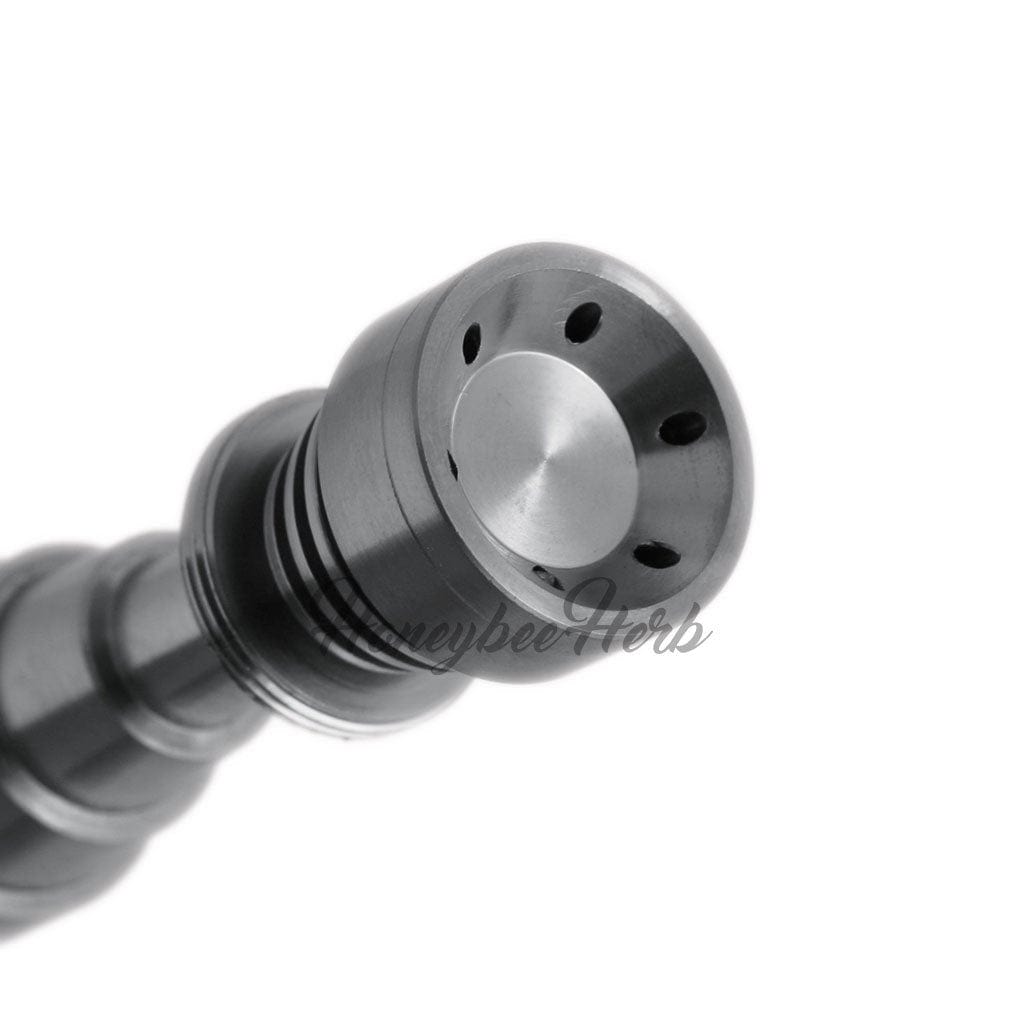 Close-up of the Titanium 6 in 1 Skillet Dab Nail, showing its metallic surface and circular openings in a high-angle shot.