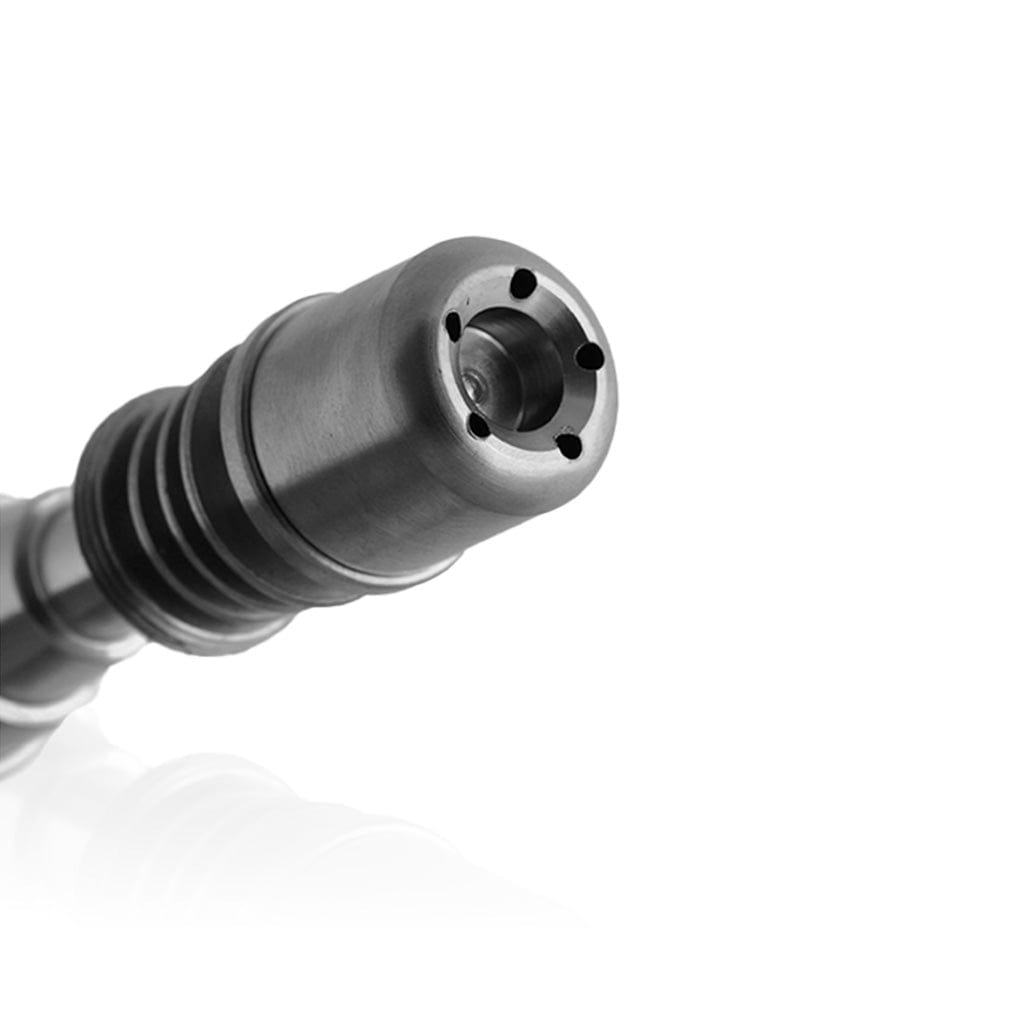 Close-up view of the Titanium 6 in 1 Skillet Enail Dab Nail, displaying its metallic tip and cylindrical shape against a blurred background.