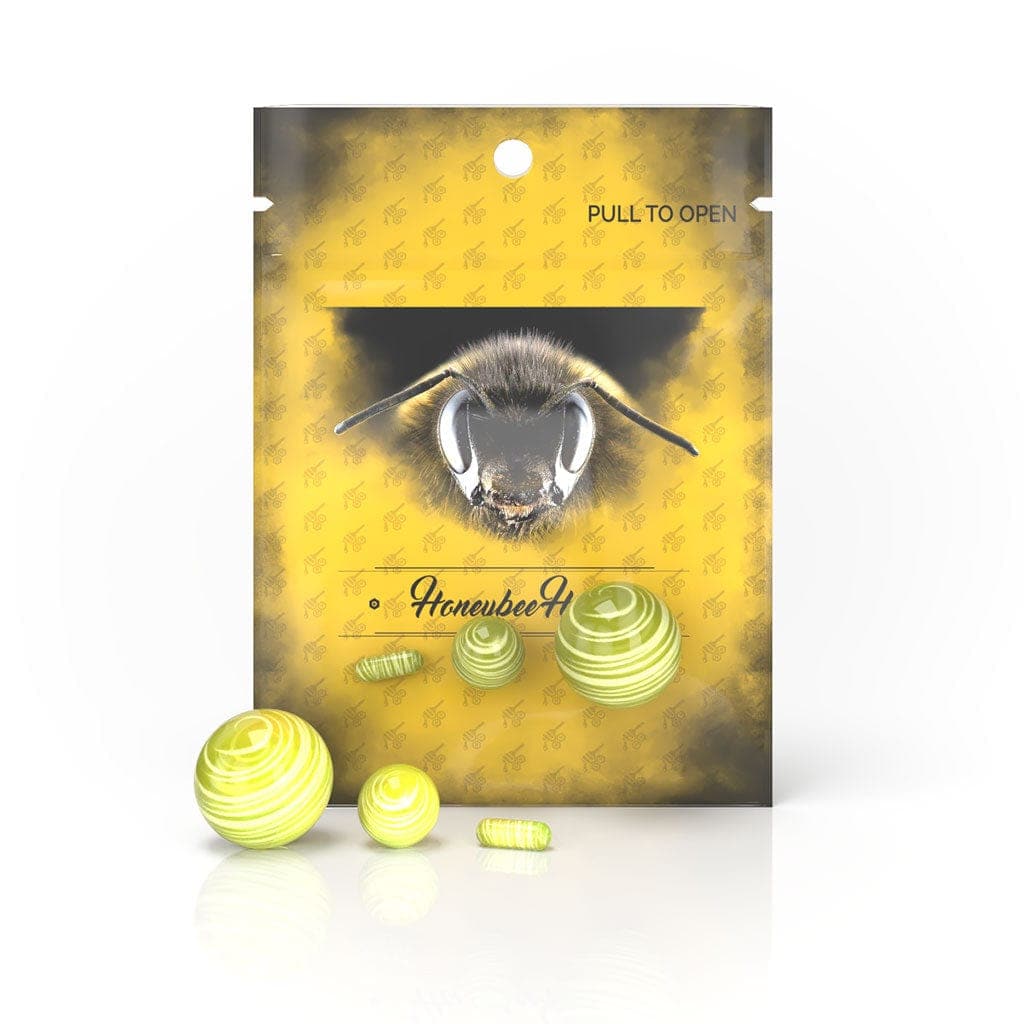 A top-down shot of the Honeybee Herb Dab Marble Set, showing a collection of colorful, spherical marbles.