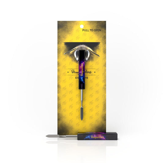Front view of the Resin Galaxy Dab Tool, presented in its packaging with a pull-to-open tab, against a black background.