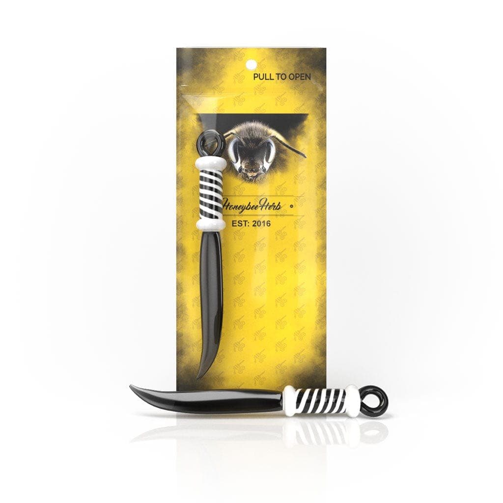 Front view of the Honeybee Herb Glass Sword Dab Tool displayed in its packaging, highlighting the sleek, sword-like design.