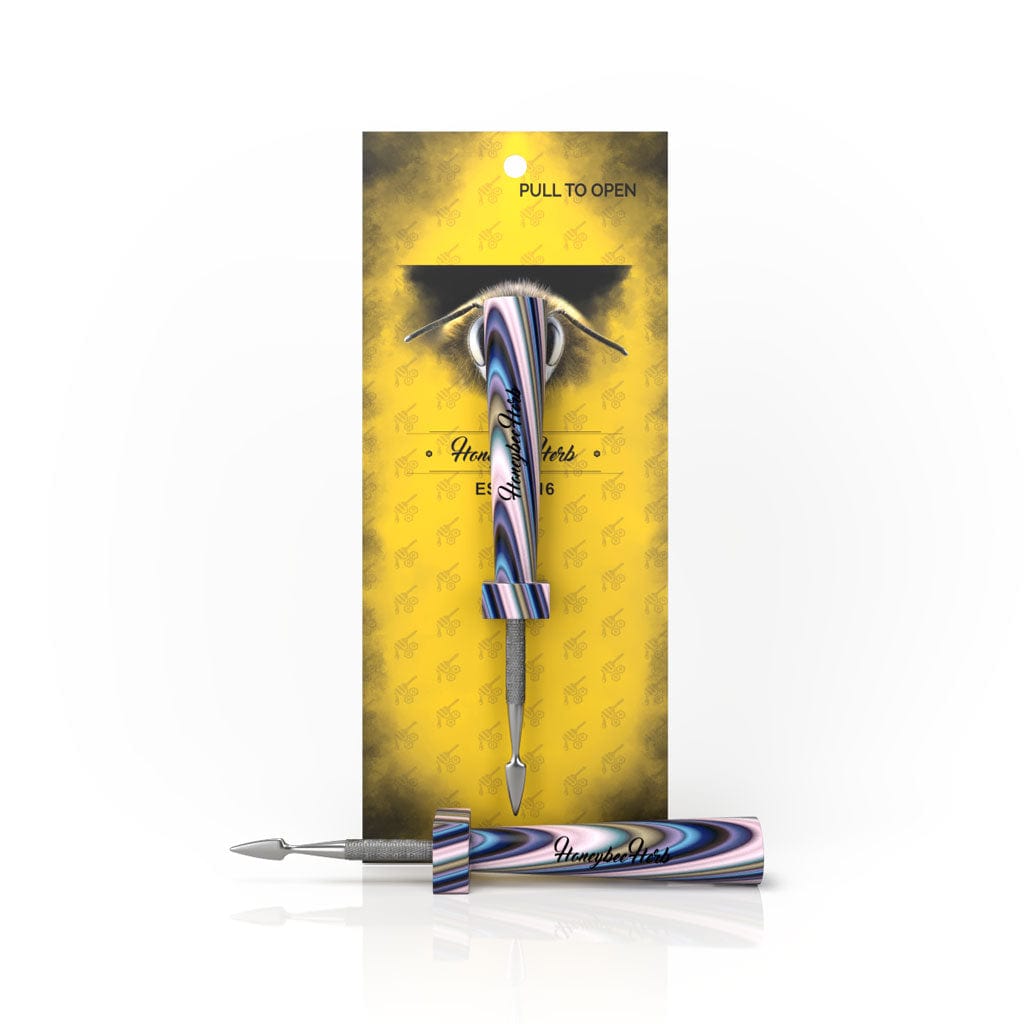 A close-up of the Classic Resin Dab Tool with a resin handle, presented in its packaging.