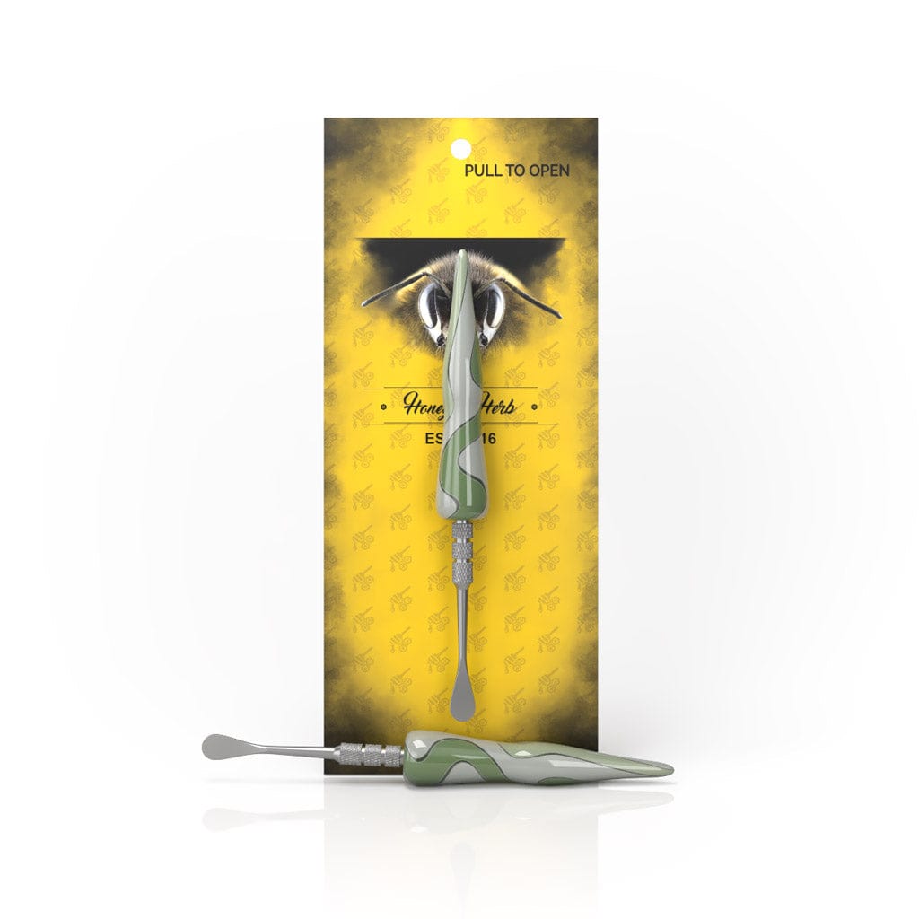 Front view of the Swirl Tide Dab Tool showing a blue-green swirled handle and metal tip against a yellow hangcard background.