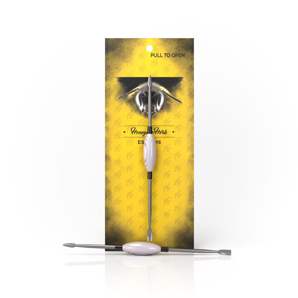 Front view of the Oval Dab Tool with a silver, rounded tip against a vibrant yellow background.