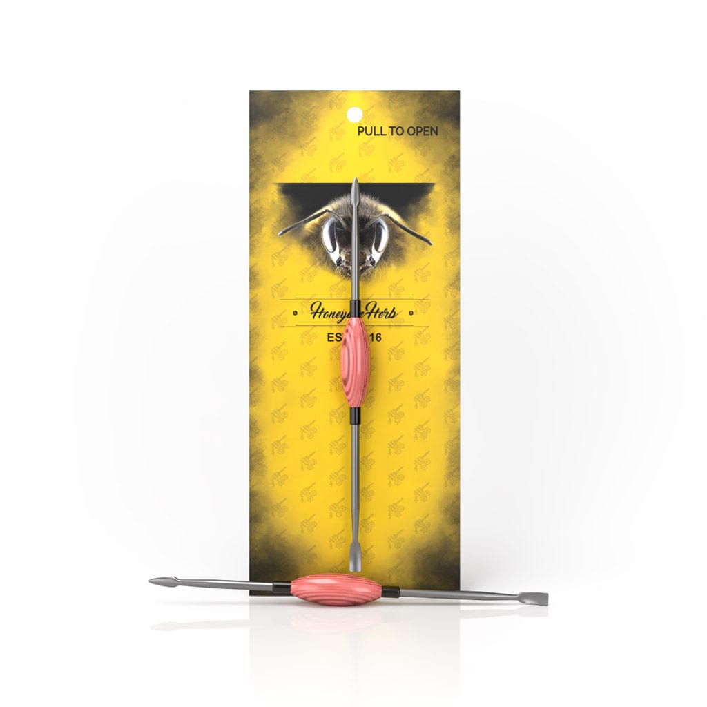 A close-up shows the Honey Dab Oval Dab Tool, with a metallic finish and smooth, curved design against a soft yellow background.