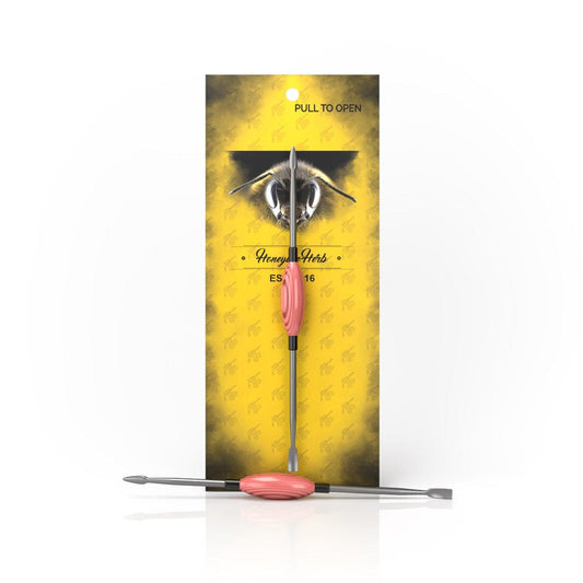 A close-up shows the Honey Dab Oval Dab Tool, with a metallic finish and smooth, curved design against a soft yellow background.