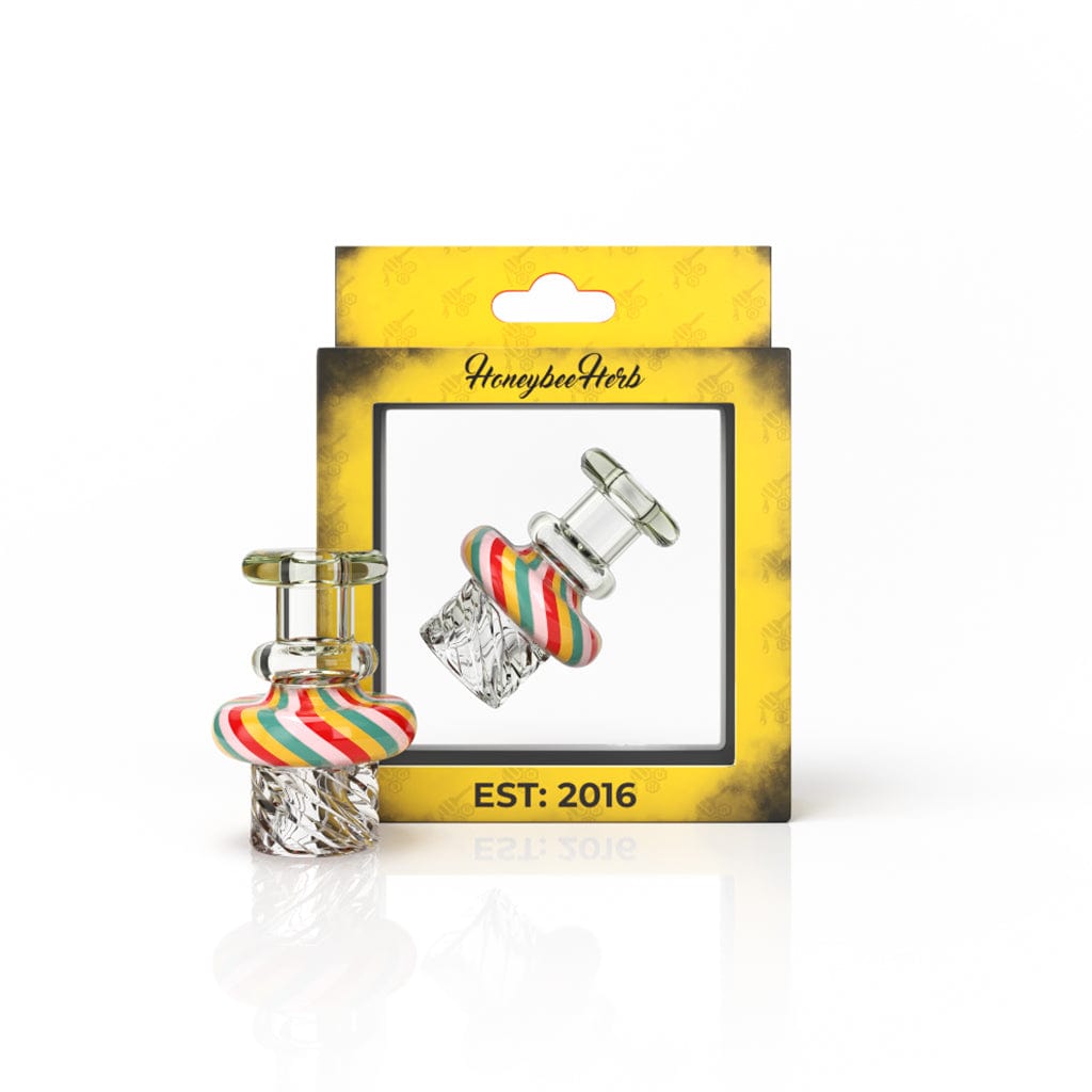 A close-up shot of the SWIRL TOP VORTEX CARB CAP, featuring a colorful, swirling glass top and metallic accents.