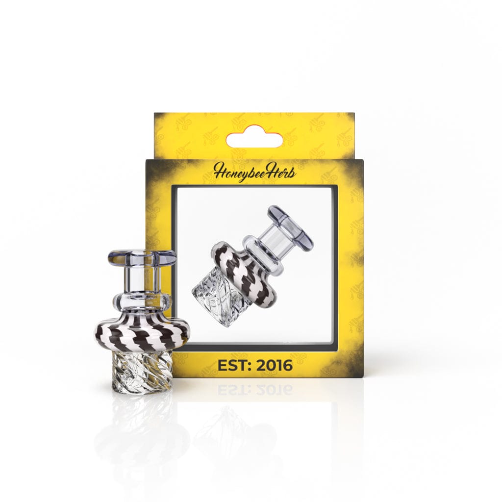 Close-up of the CYCLONE VORTEX CARB CAP, a small, silver carb cap angled against a dark background.