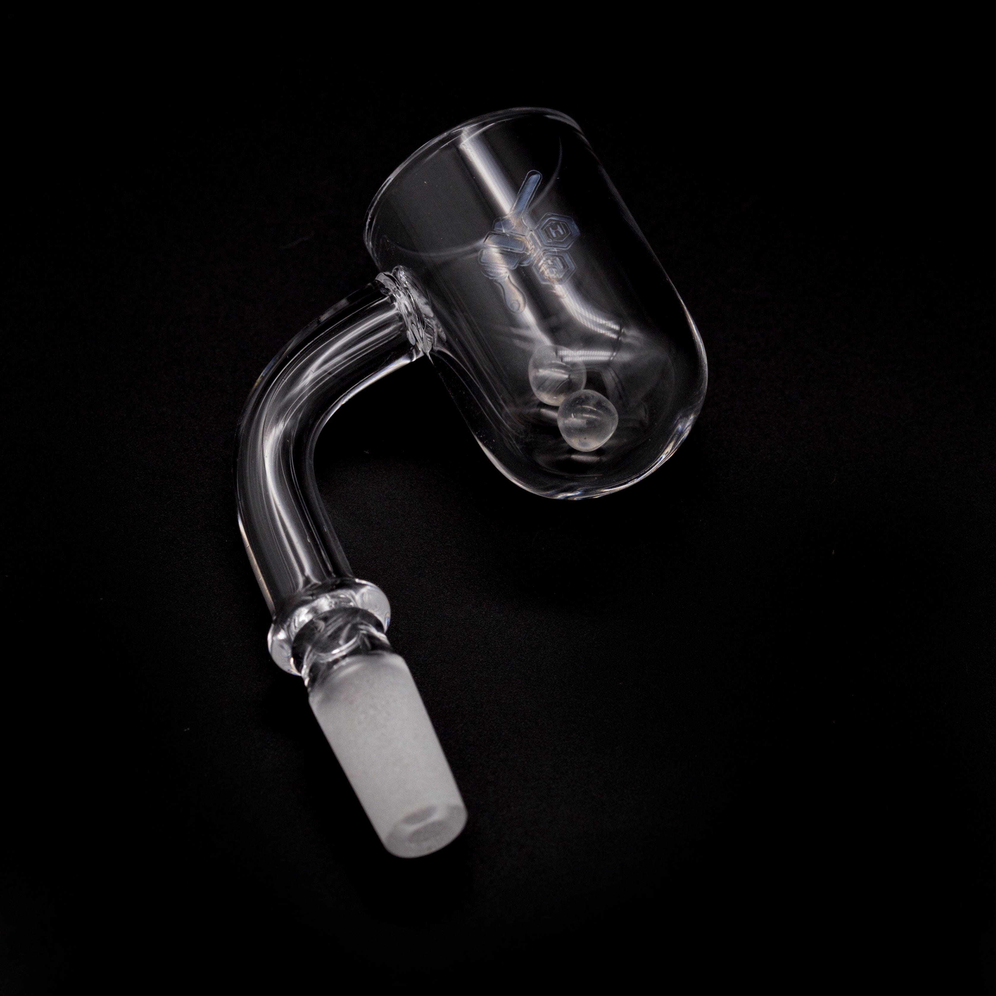 A close-up, angled view of the HONEY CYCLONE QUARTZ BANGER - 90° DEGREE, showing its clear quartz construction and cylindrical shape.