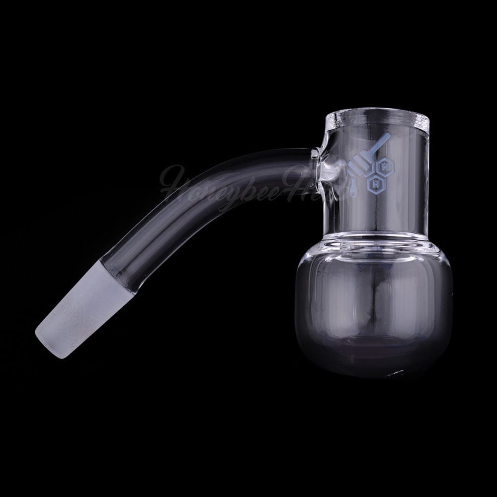 A close-up, angled view showcases the HONEY KETTLE QUARTZ BANGER - 45° DEGREE, featuring a smooth, polished quartz construction.