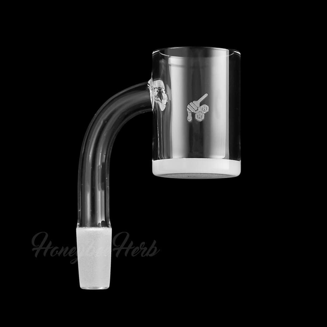 A close-up, angled view of the Honey & Milk Quartz Banger - 90° Degree, showing its clear quartz construction and rounded shape.