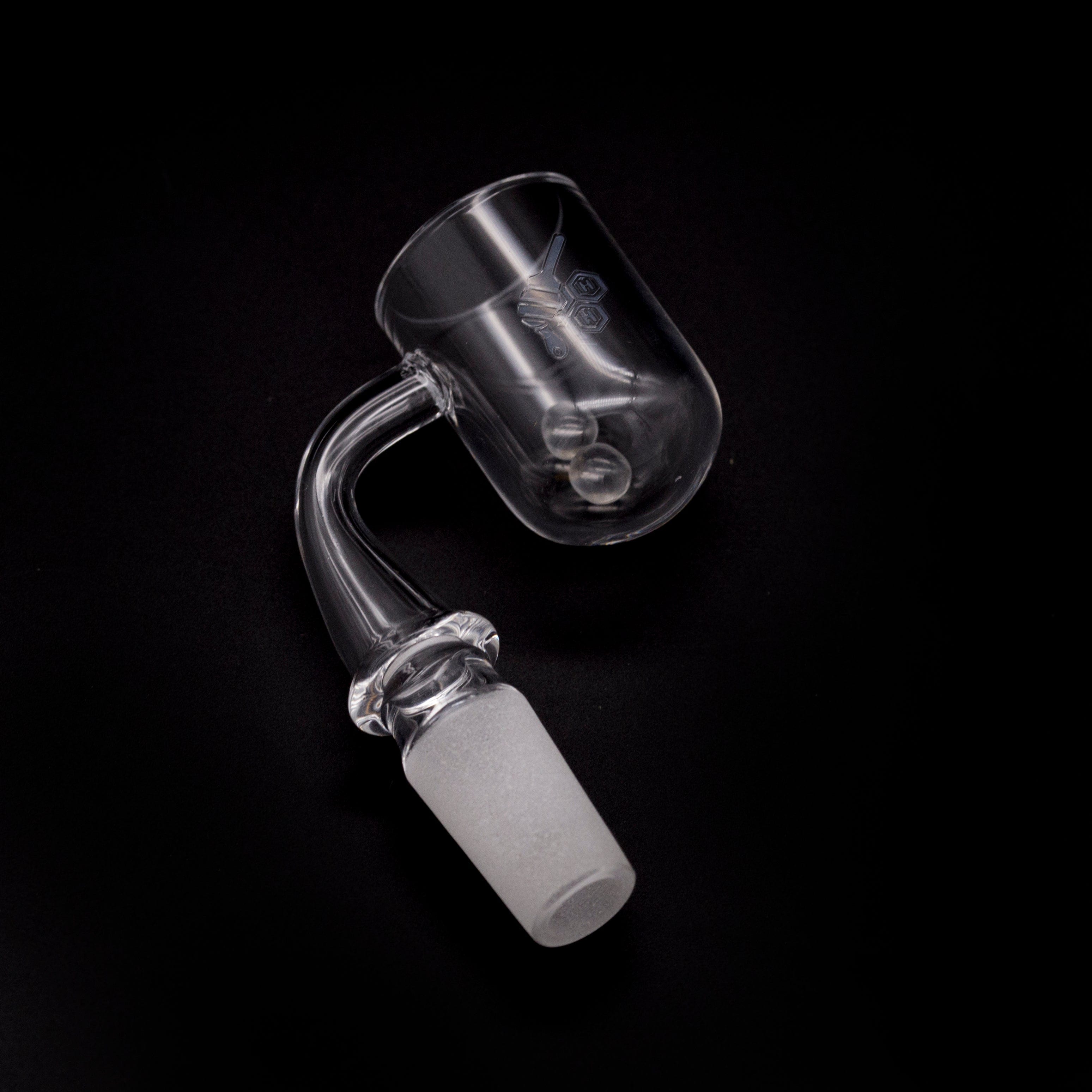 A three-quarter view of the HONEY CYCLONE QUARTZ BANGER - 90° DEGREE, showing its angled quartz cup and smooth, clear glass joint.