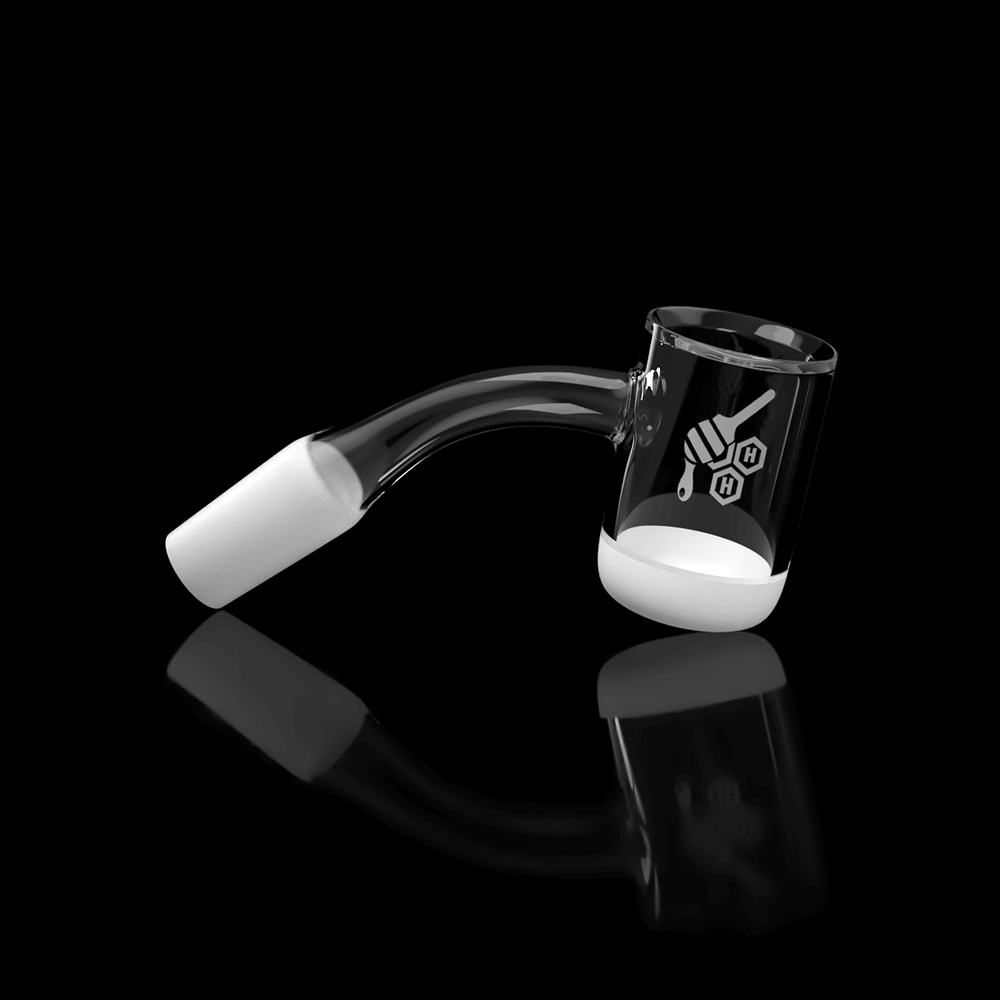 A 45-degree angled view of the HONEY & MILK BEVEL BOWL QUARTZ BANGER, reflecting brightly on a dark surface.