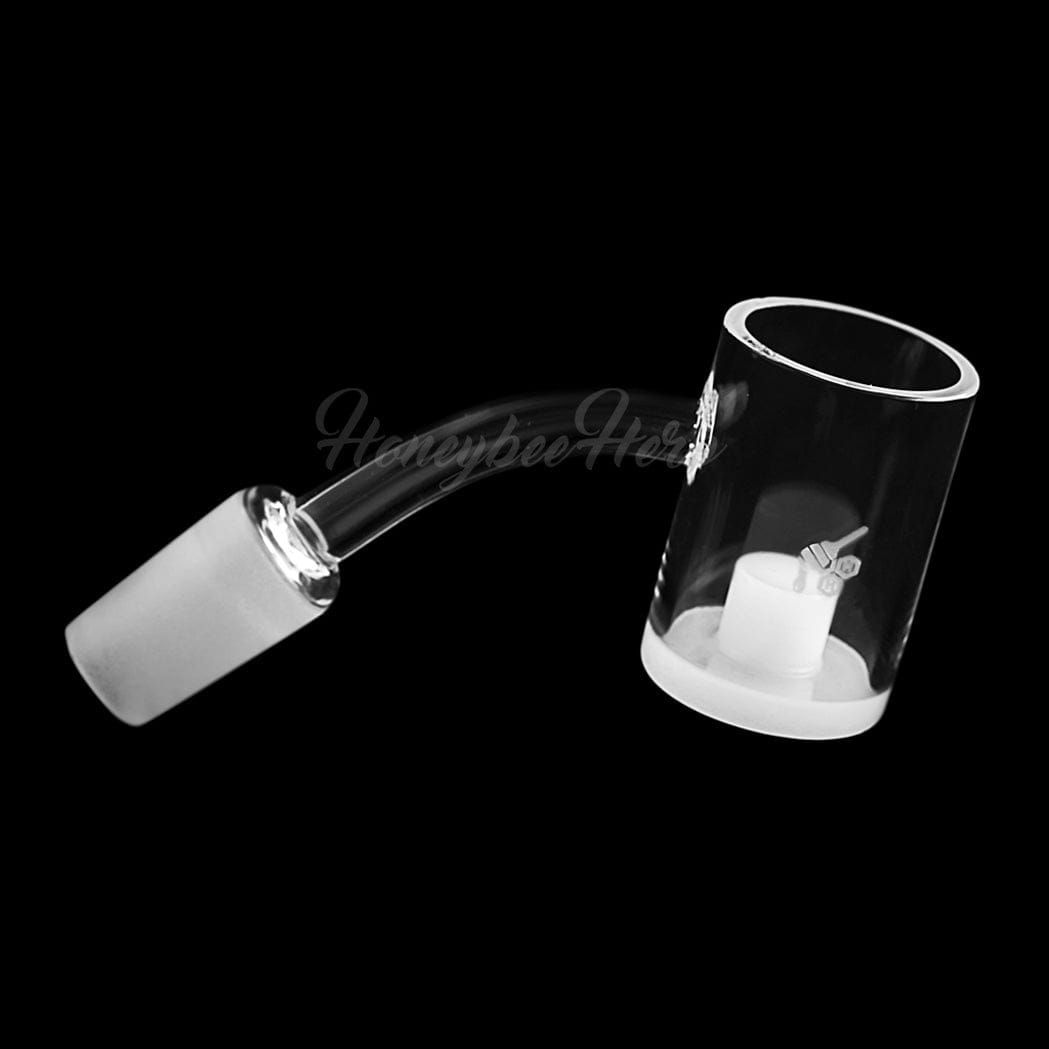 Angled close-up of the HONEY & MILK CORE REACTOR QUARTZ BANGER - 45° DEGREE | YL showing its curved 45° joint and clear cylindrical bucket on a black background