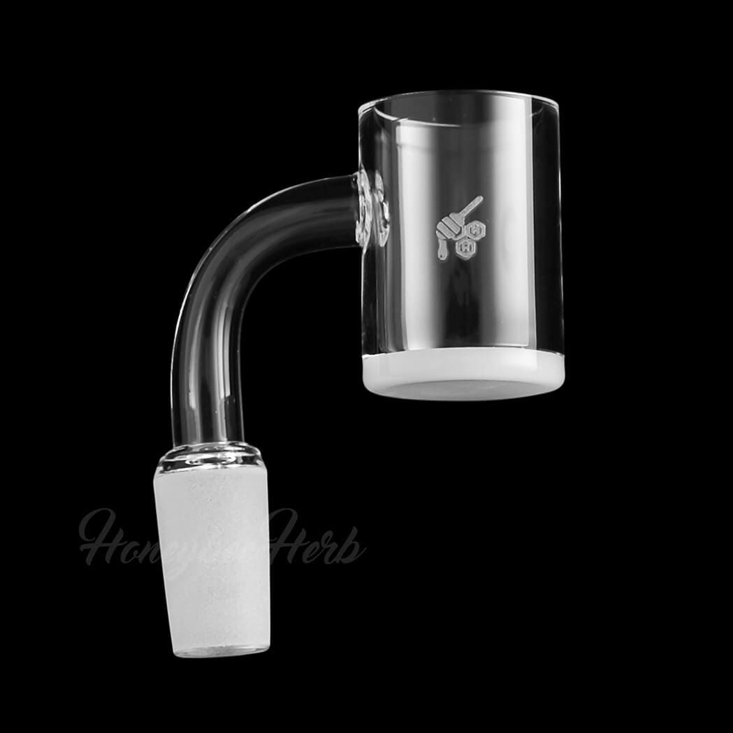A studio shot of the Honey & Milk Quartz Banger - 90° Degree, angled to showcase its clear quartz construction and rounded shape.