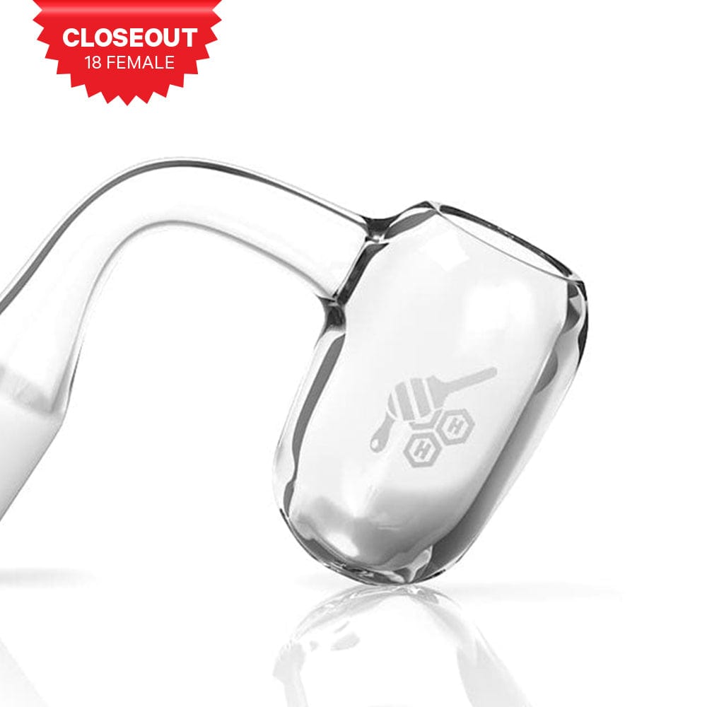 A close-up, angled view of the HONEY BARREL QUARTZ BANGER - 90° DEGREE  YL, showcasing its clear glass construction.