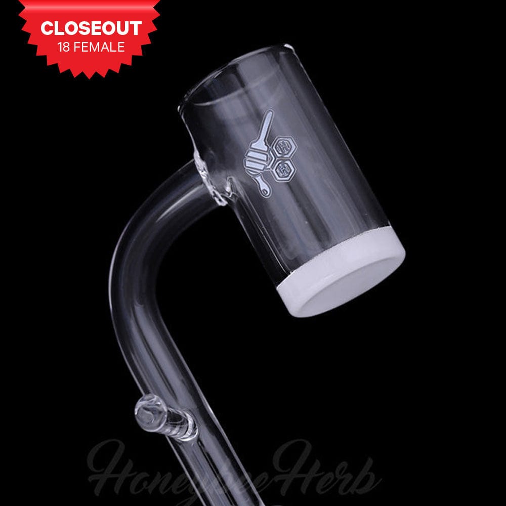 Angled close-up against a black background of the HONEY & MILK ENAIL QUARTZ BANGER - 90Â° DEGREE | YL showing its 90-degree clear glass joint and white-bottom bucket with a small honey-dipper logo.