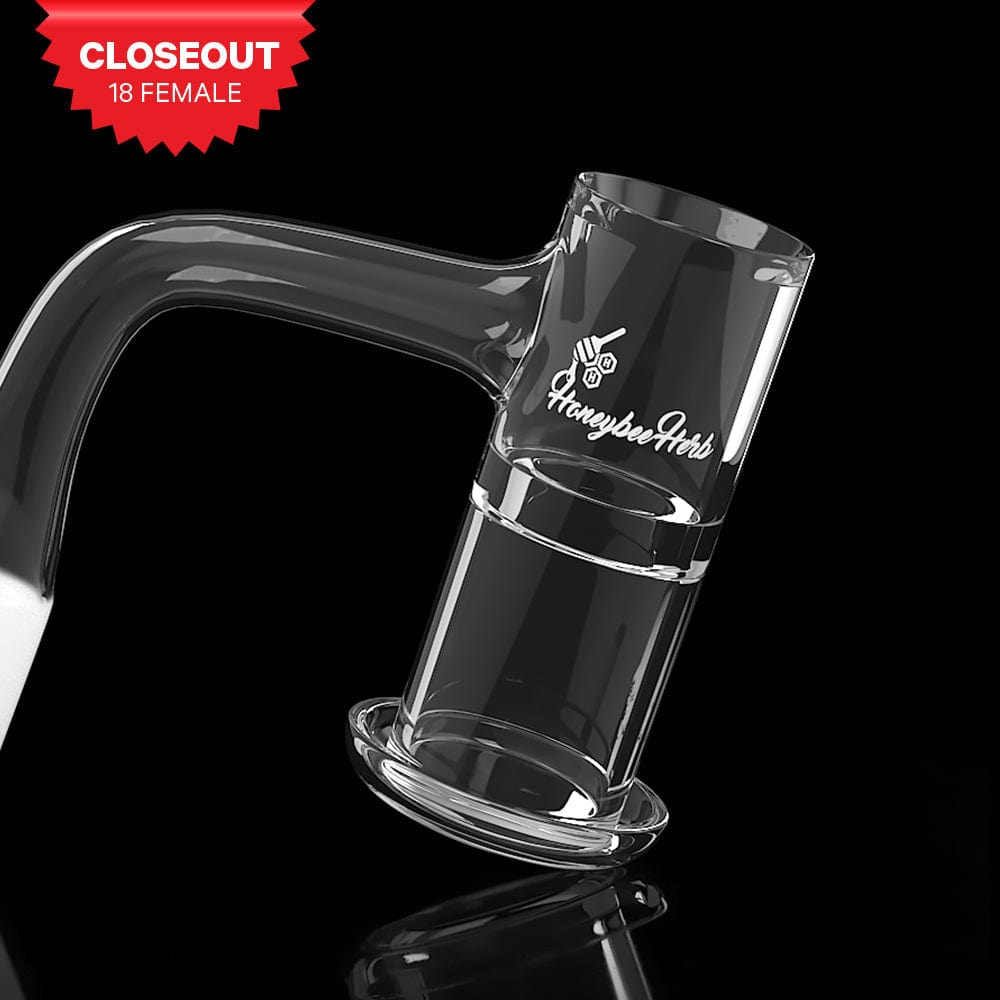 Angled close-up of the Honeysuckle Xl Quartz Banger - 90Â° Degree | Bl showing its clear glass joint and cup against a black reflective background.
