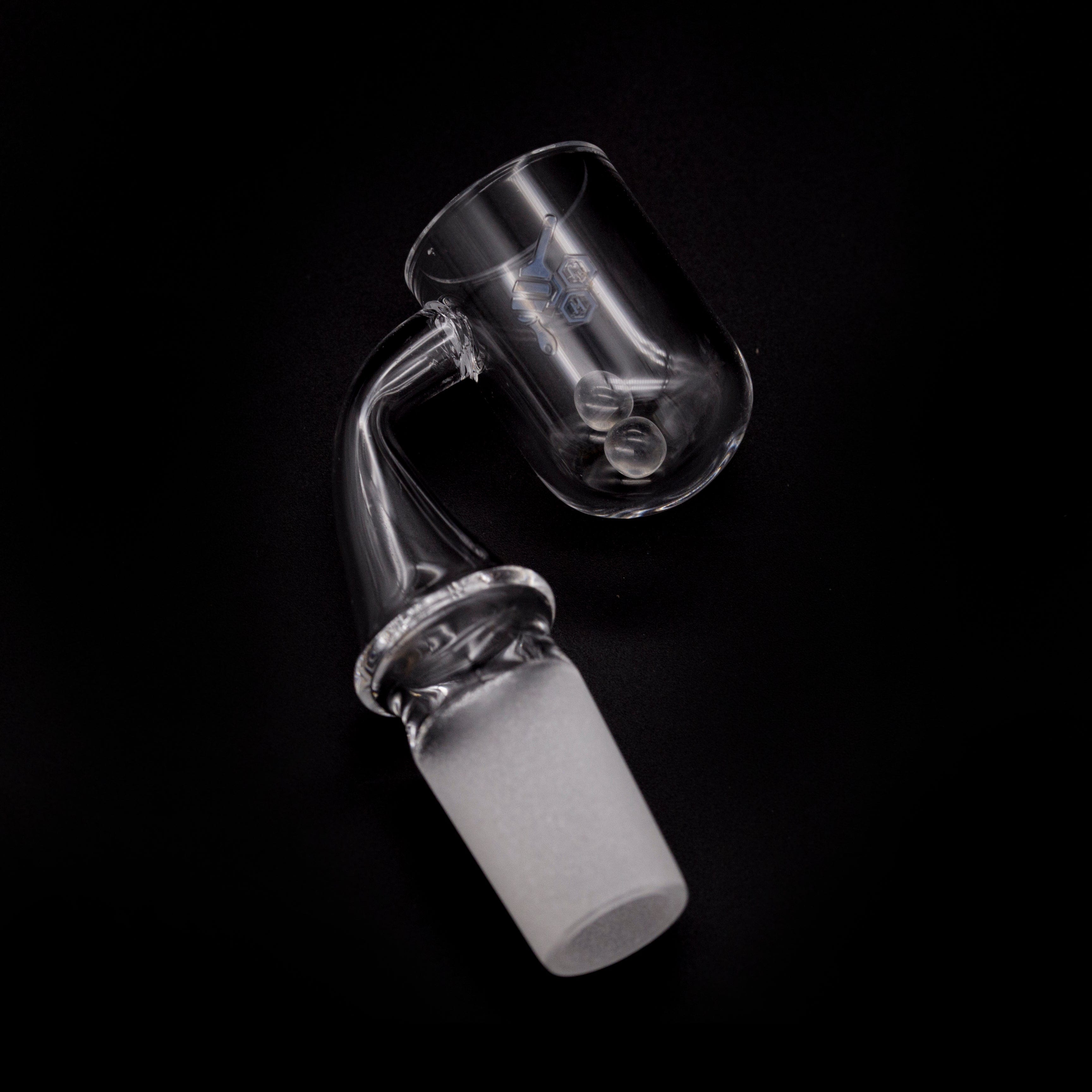 A close-up, angled view of the HONEY CYCLONE QUARTZ BANGER - 90° DEGREE, showing its clear quartz construction and angled design.